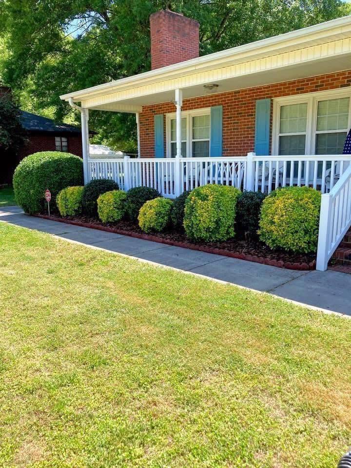Landscape bed renovation with shrubs and edging